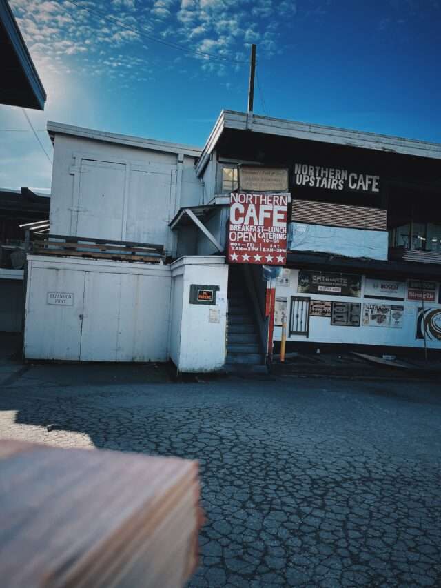 Northern Cafe exterior above South Vancouver lumberyard